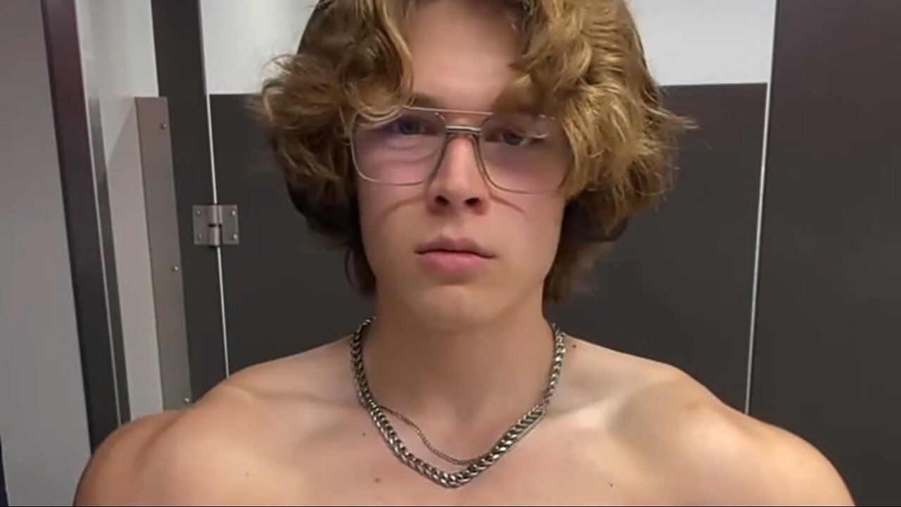 Young bodybuilder flexing muscles