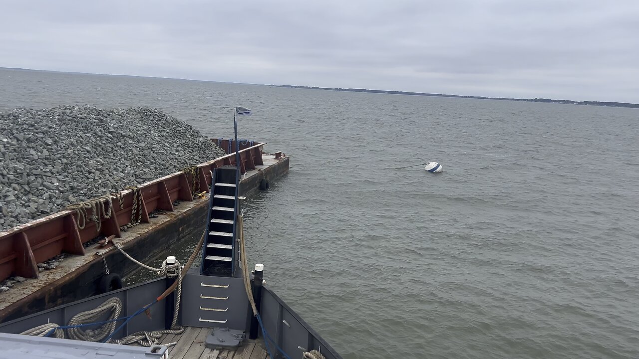 Short video of tug boat on mooring ball with barge