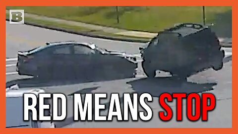 Driver Runs Red Light, Smashes Into Vehicle, Flips Over