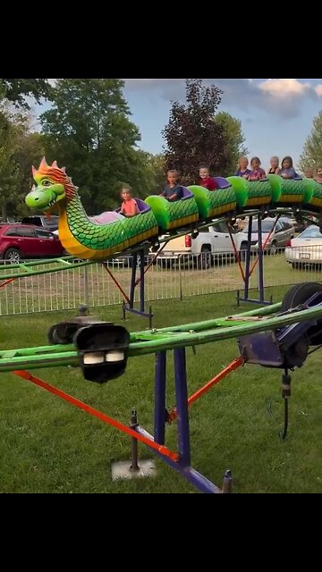 Children watch their own amusement park ride break