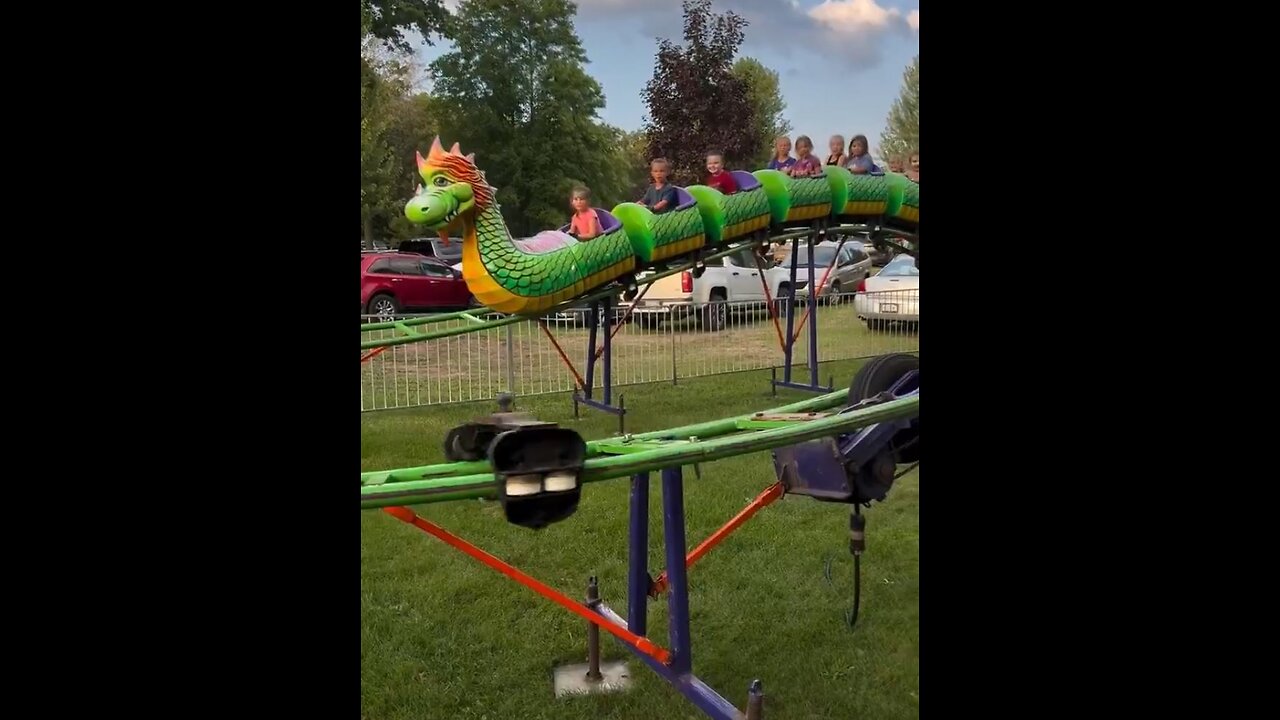 Children watch their own amusement park ride break