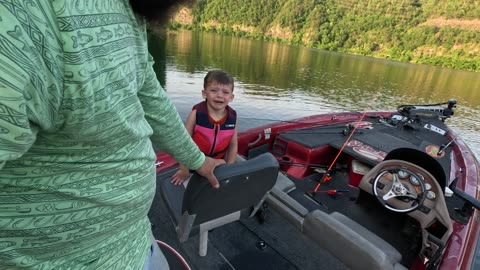 Dad Calmly Rescues Son Who Falls Into Lake Water During Fishing Trip