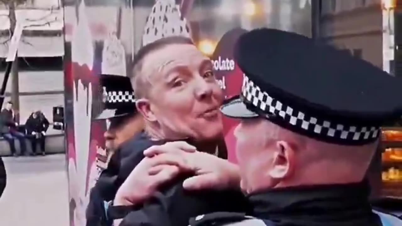 British man counter-demonstrates a pro-Palestine protest with a Union Jack flag