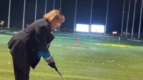 Golf is harder than it looks! 🎯😂 This lady took a swing but totally lost her balance! ⛳🤣
