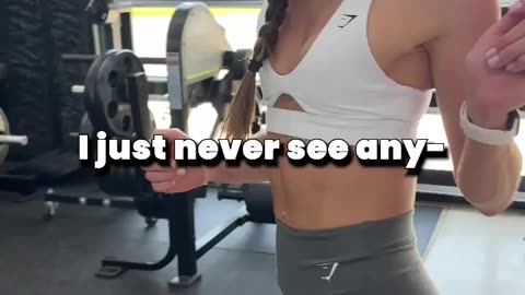 Girl lifting weights and her trainer 2