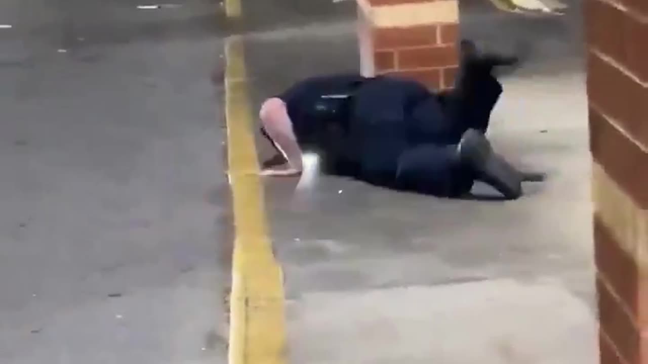 Policeman down and no one helps him. Sick society.