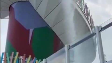 ‘STOP THE SLIDE!’ Passengers panic as a slide panel shatters on the world’s....