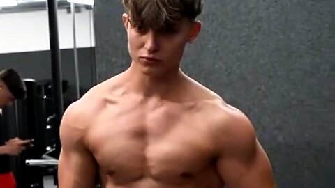18 years old teen bodybuilder flexing muscles