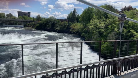Spokane falls, on a bridge at a high point over Spokane falls with the surrounding skyline