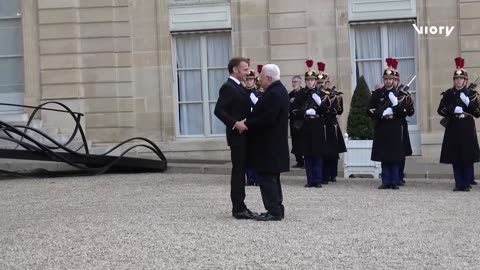 President Macron greets Palestine's Abbas at Elysee Palace
