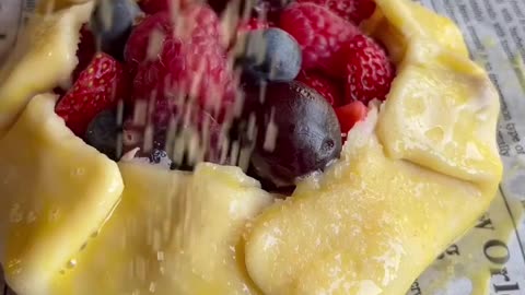 A strawberry & blueberry pie with ice cream, beautiful and delicious dessert.