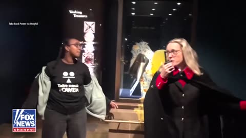 Police have arrested “tax the rich” protesters who threw apple crumble and yellow custard