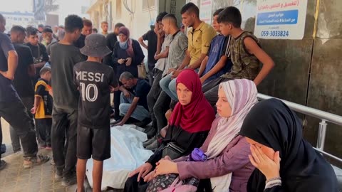 Palestinians mourn those killed as Israeli forces pound Gaza City
			