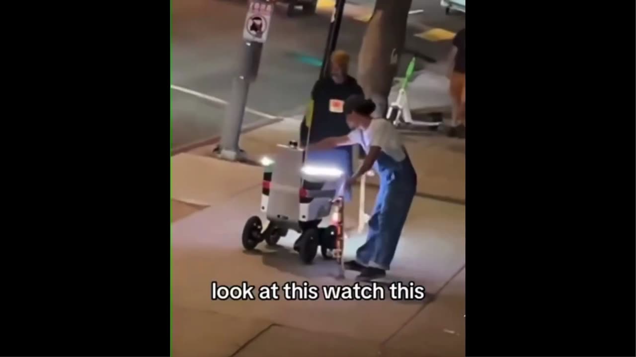 Man overturns Food Delivery Robot
