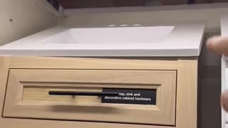 Woman at Home Depot doesn't realize countertops & sinks are tilted for display only