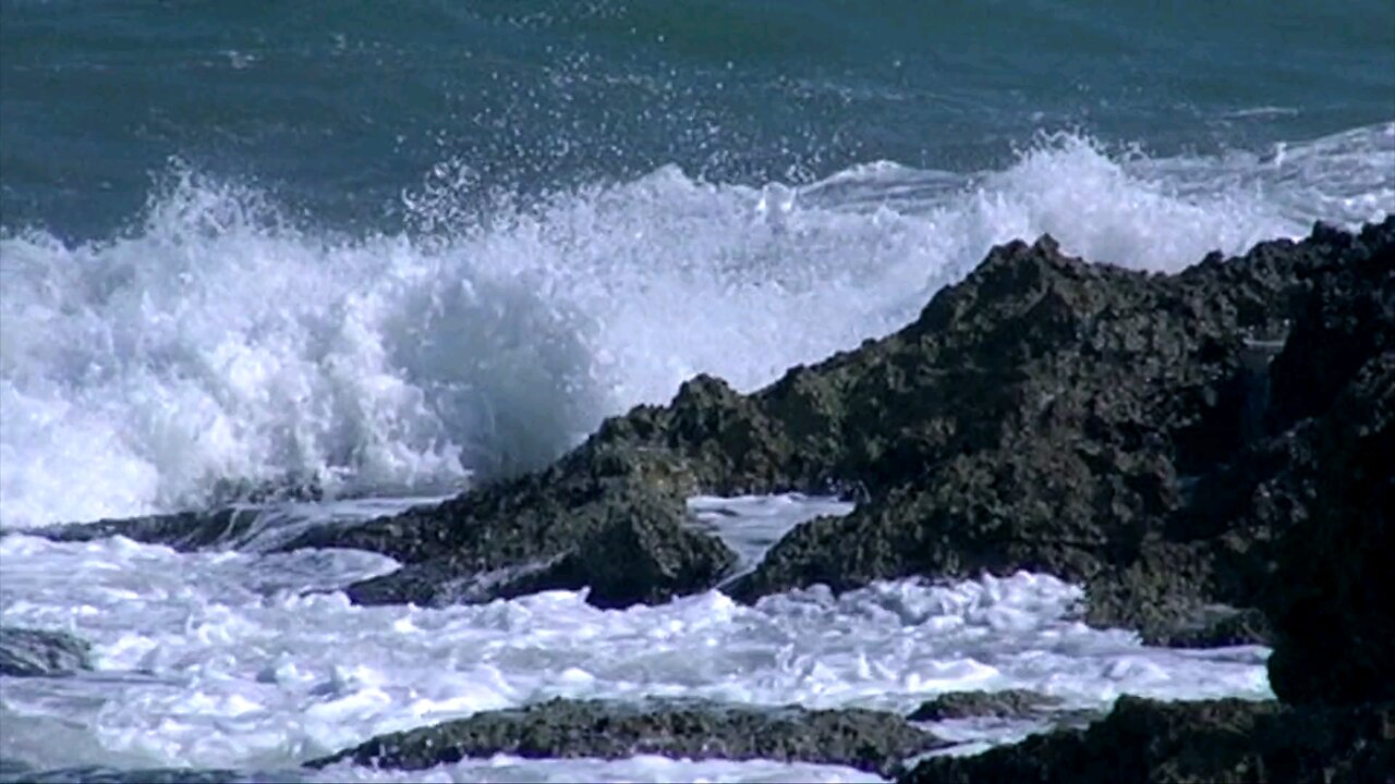Waves Crashing To The Rocks