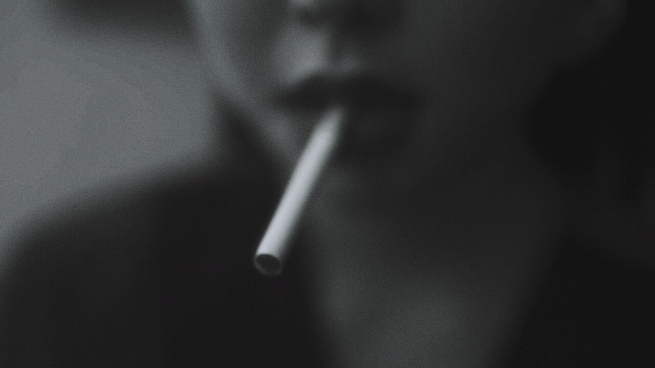 Close up View of a Woman Lighting a Cigarette with a Match