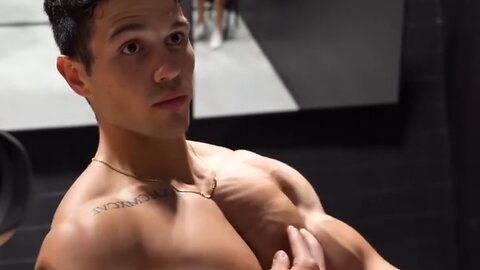 Young man flexing muscles