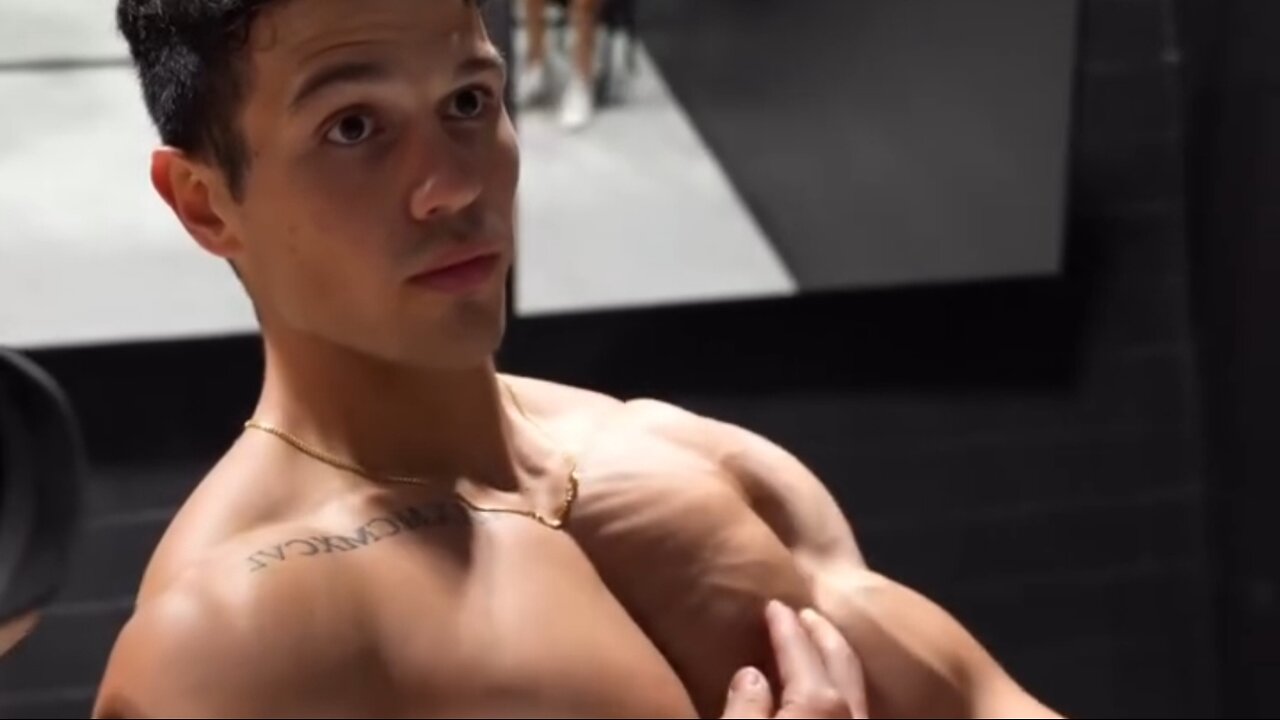 Young man flexing muscles