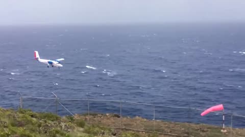 Landing of a DHC-6 Twin Otter at the airport of the Caribbean island of Saba