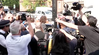 Russell Brand leaves court after hearing over alleged sex offenses