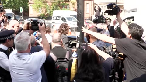 Russell Brand leaves court after hearing over alleged sex offenses