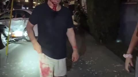 A drunk driver drove through a red light when two pedestrians were crossing the street.