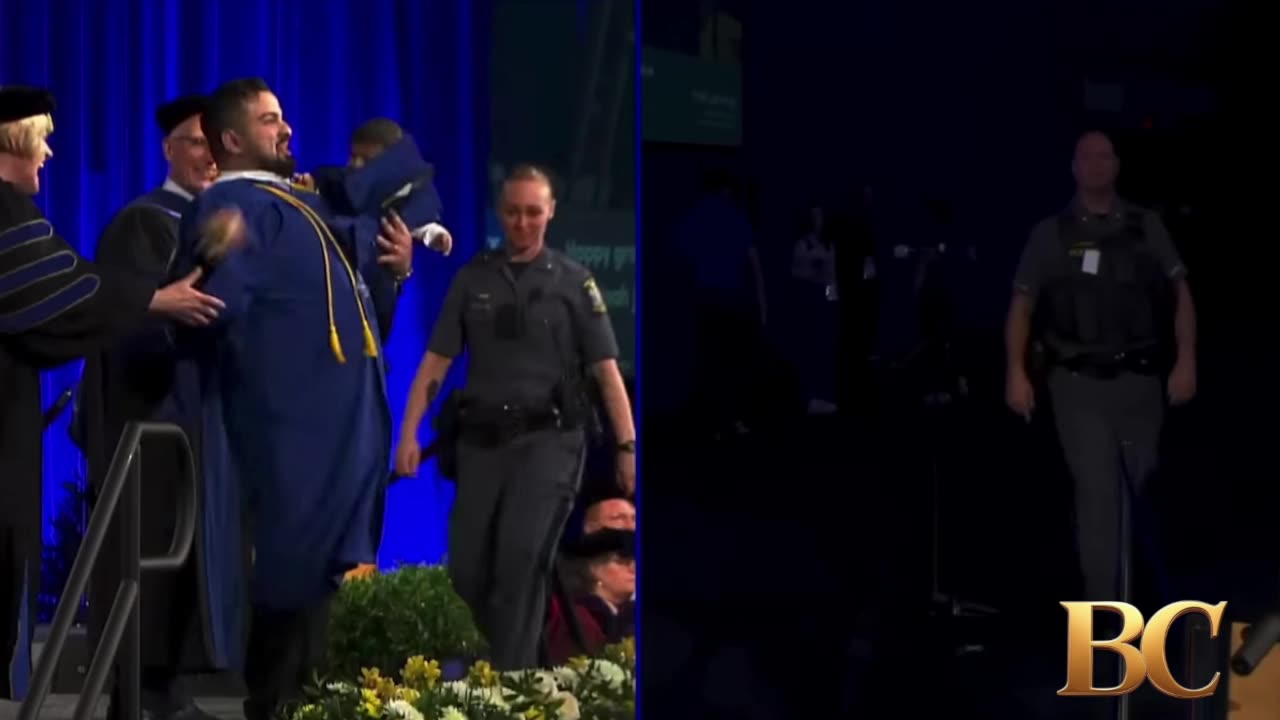 University of Buffalo grad chased by police as he runs across stage holding his baby