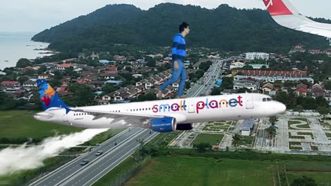 Magic Dekho-34-Standing On Plane Malaysia