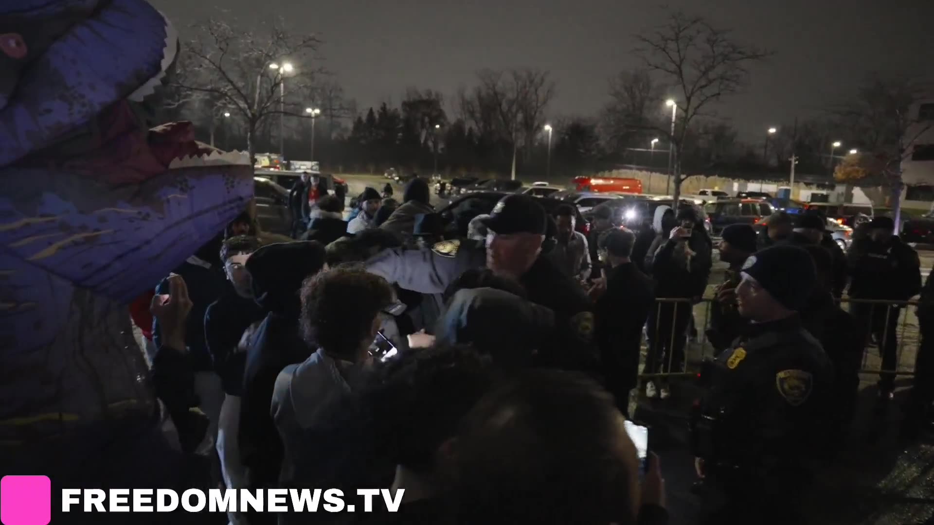 Protester appears detained as Dearborn Michigan police encircle "Americans Against