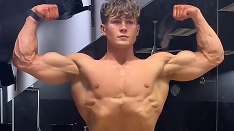 Handsome muscular guy showing off his muscles