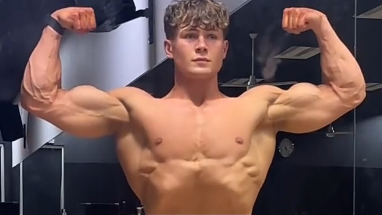 Handsome muscular guy showing off his muscles