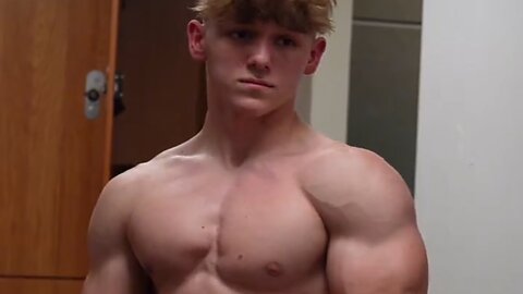 17 years old teen boy flexing muscles