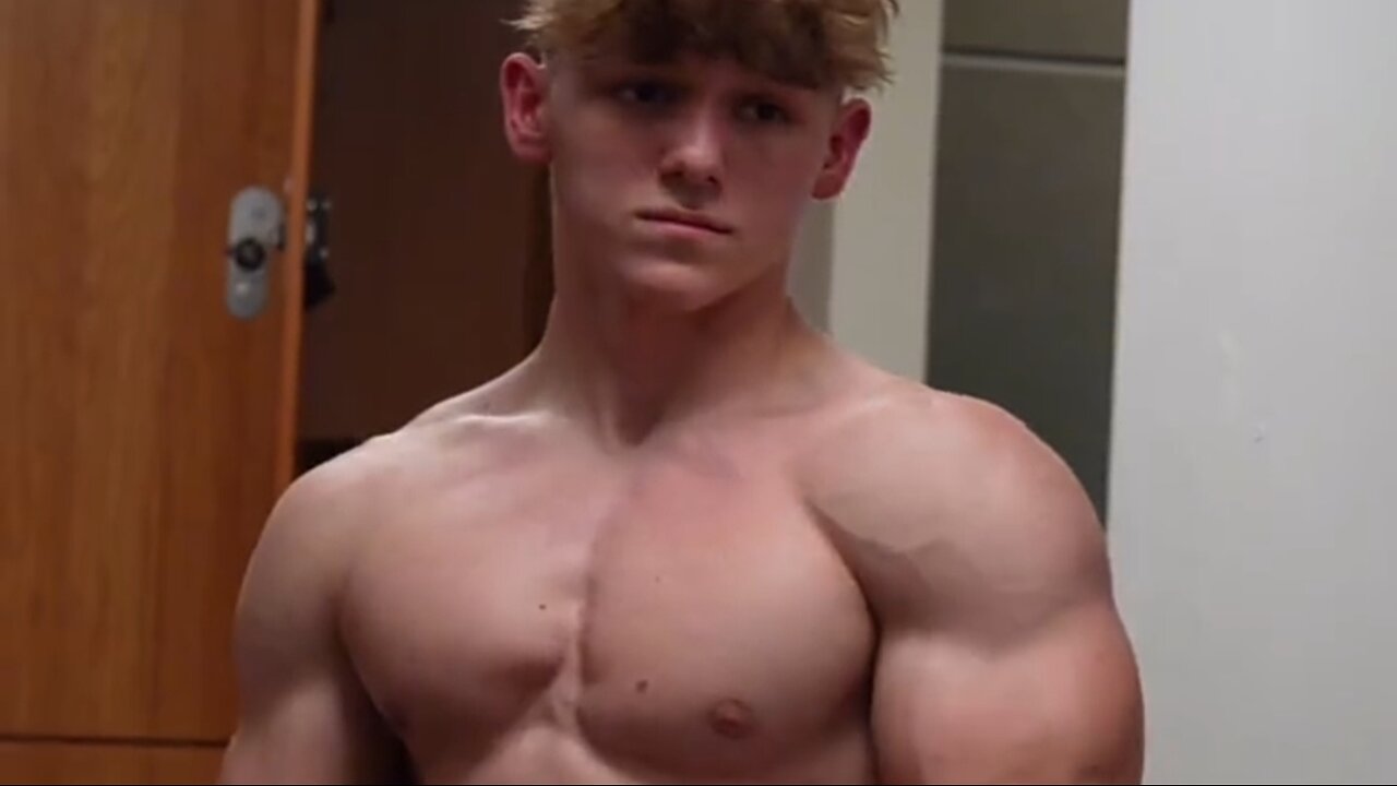 17 years old teen boy flexing muscles
