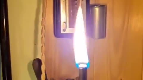 An antique French electric lighter from the 1900s in action..Essentially a tiny oil lamp meets electric