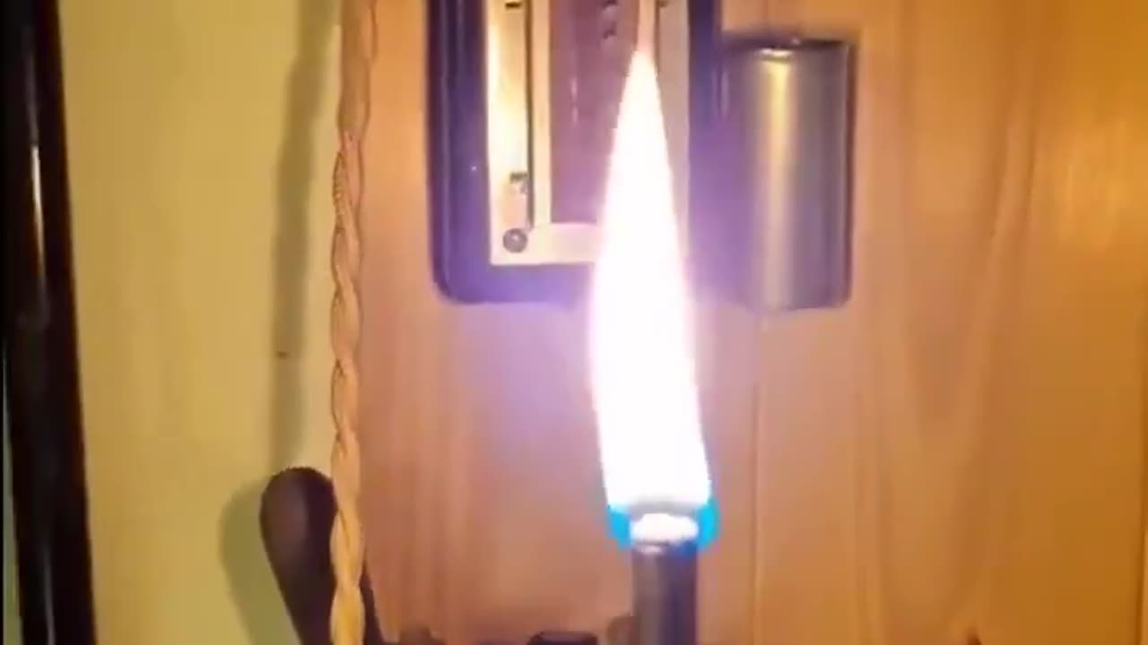 An antique French electric lighter from the 1900s in action..Essentially a tiny oil lamp meets electric