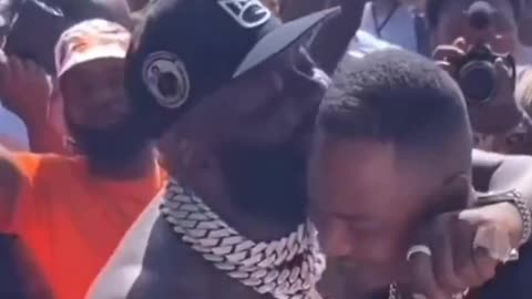 50 Cent is wondering if Rick Ross was hugging up on a man?!