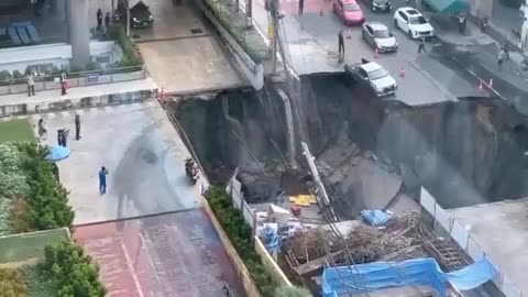 Massive sinkhole opens up in Bangkok, swallowing parts of a busy street