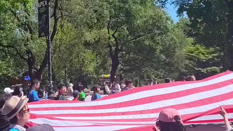 4th Annual Japan Parade in New York City. Huge USA flag.