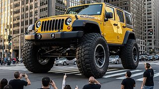 People Watching Giant Jeep Driving On The road