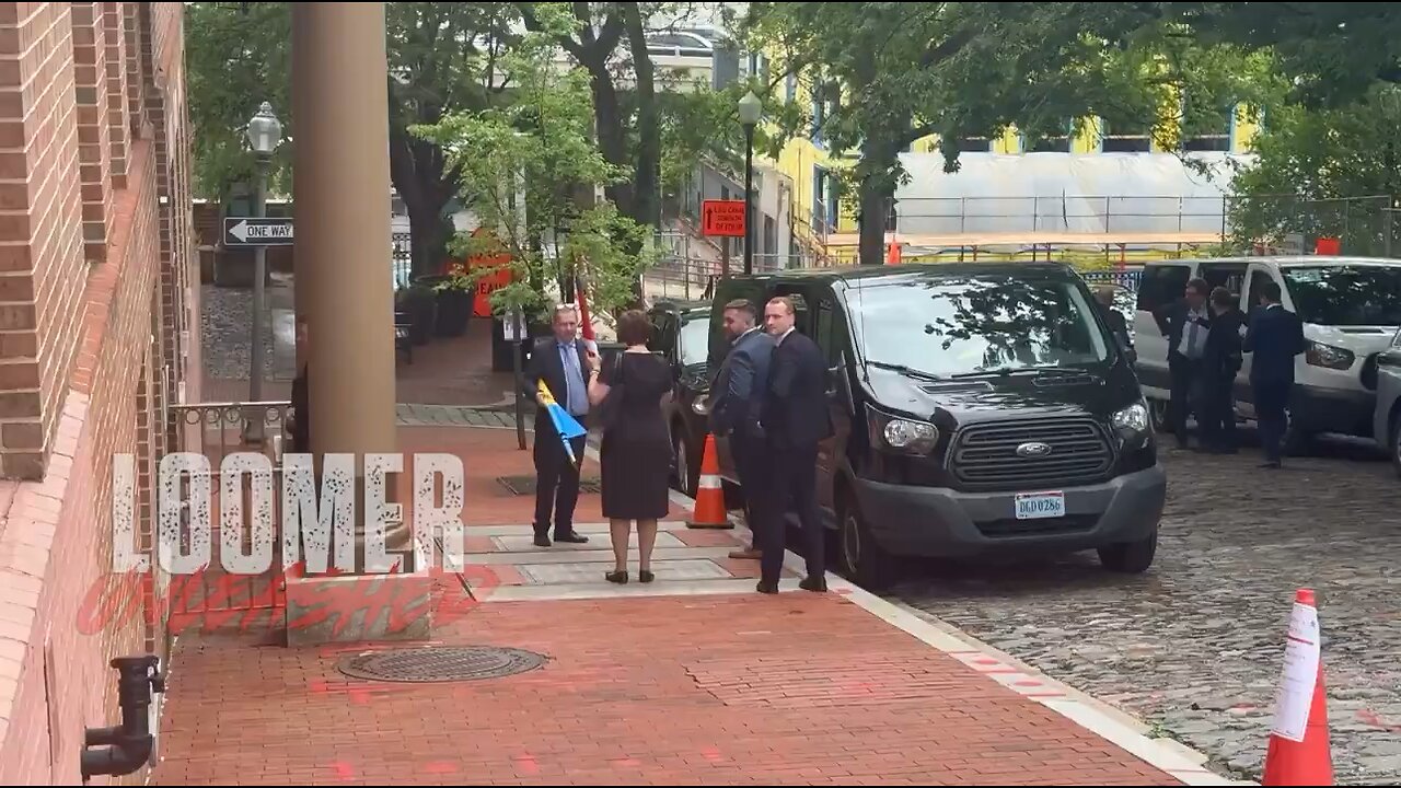just caught US officials on video walking Ukrainian flags and American flags into the Ukrainian Emb