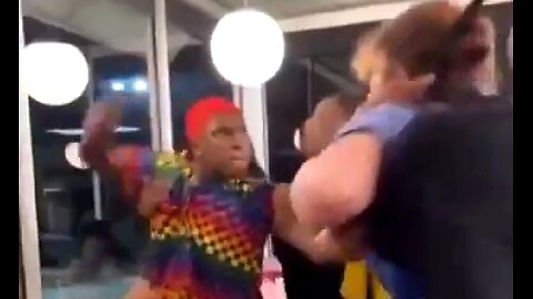 PSYCHOTIC CROSS-DRESSING NEGROID VICIOUSLY ATTACKS WHITE WOMAN AT FAST FOOD OUTLET 🐒