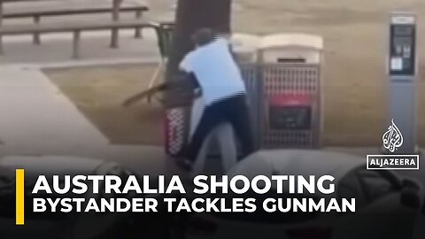 Video shows bystander tackling and disarming one of the shooters at Sydney’s Bondi Beach