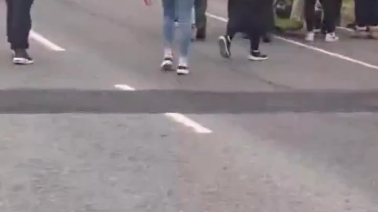 An elderly Irish lady cut off a couple of cable ties that were holding fences together