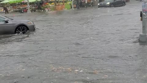 Flooded Street Traps NYC Residents In Store