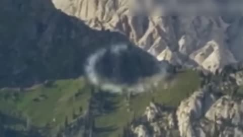 UFO Goes Through Portal in Mountains