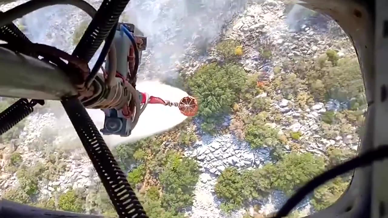 Helicopters douse raging wildfire in Turkey's southwest