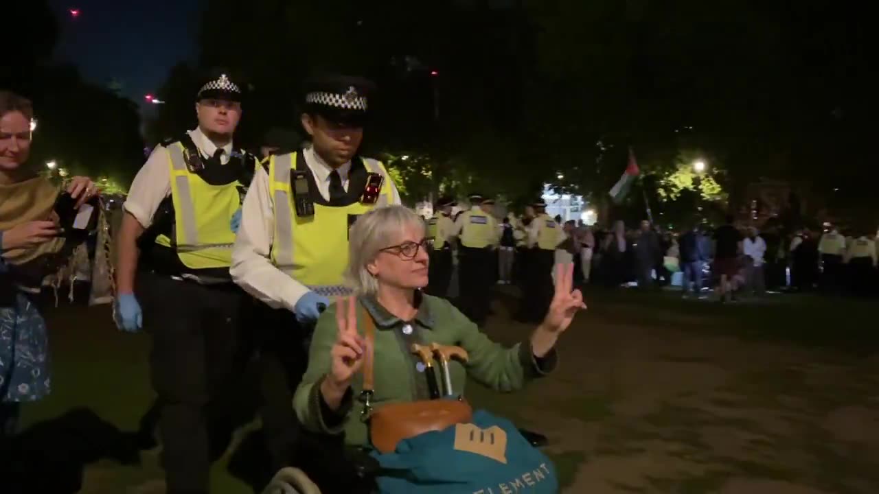 A wheelchair user arrested under the Terrorism Act for holding a sign