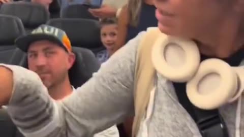 Argument breaks out on plane after female lawyer is accused of cutting the line.