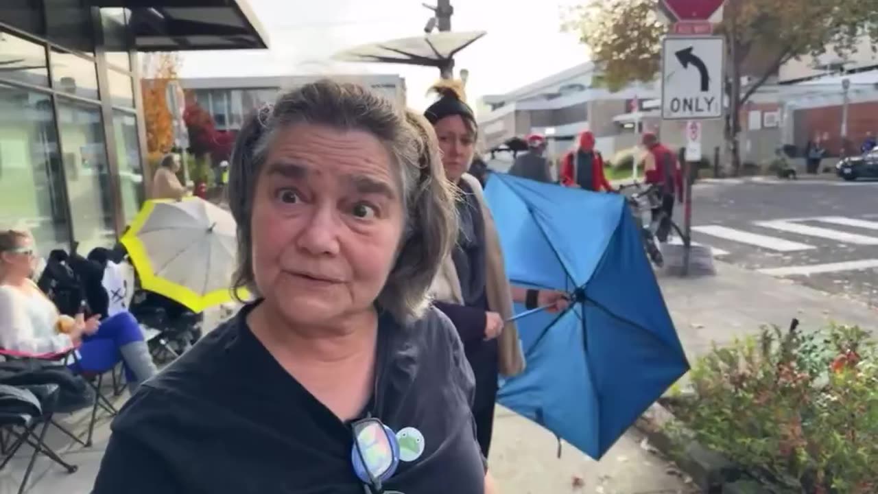 Protestor sets up pre-printed signs ahead of the “Degenerates Against Fascism” protest